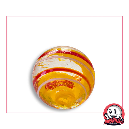 Bille Tortitta Jaune 25 mm Collector en verre jaune-orangé translucide rayé de rouge et de blanc, vue de dessus, 25 mm de diamètre